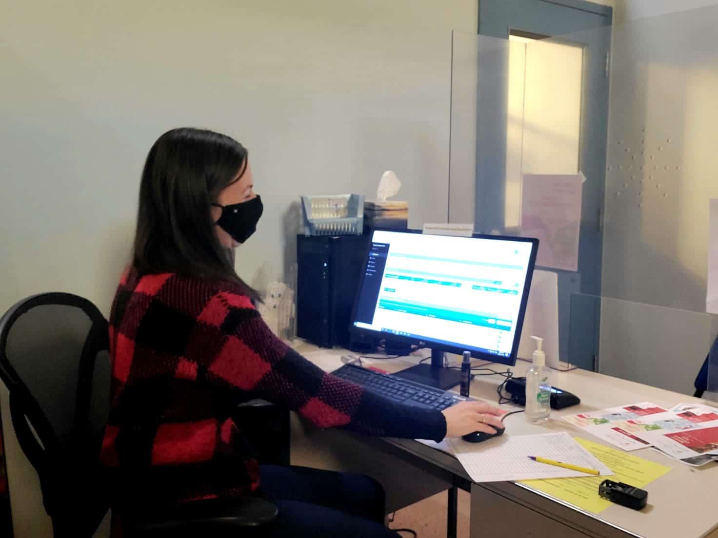 Woman at desk using case management software