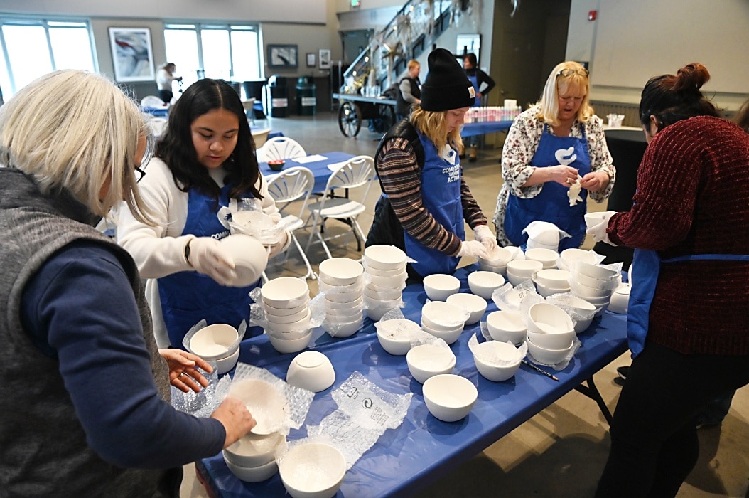 Chelan Douglas Community Action Council volunteers prepare containers for food distribution